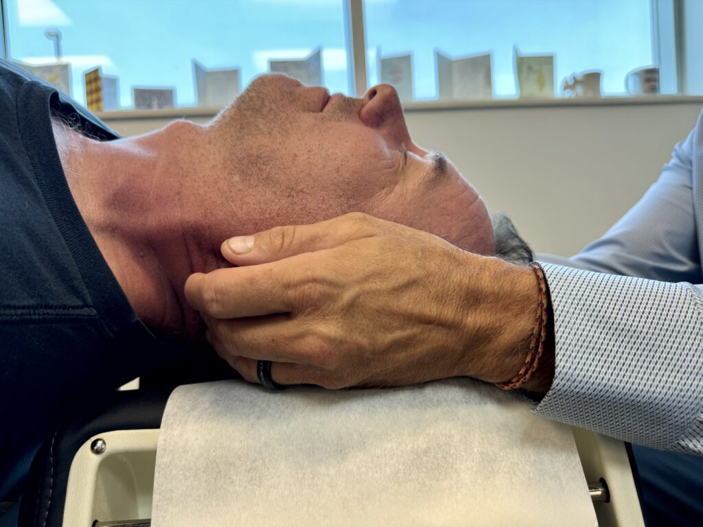 Dr. Scott Graziosa having a neck pain treatment