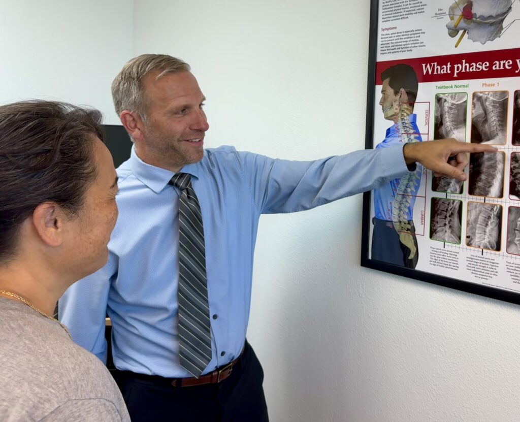 Dr Scott Graziosa working with patient