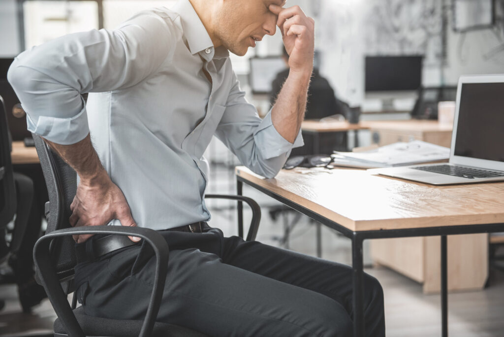 a man suffering from lower back after his work