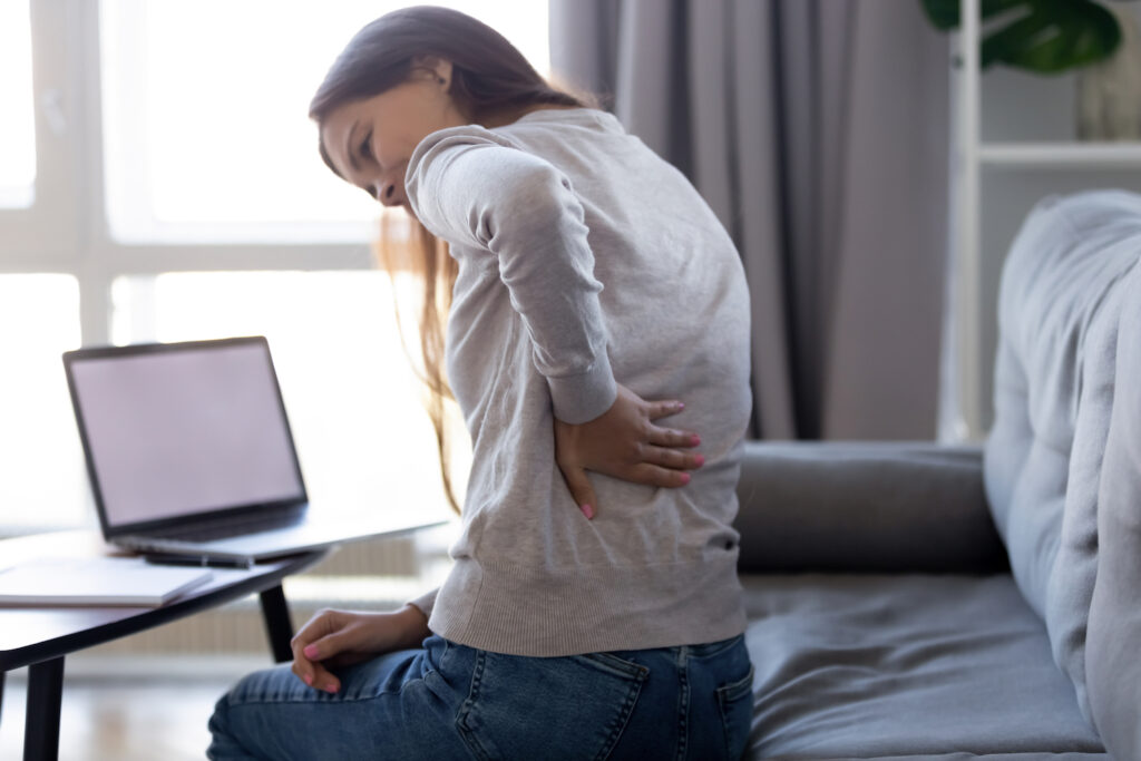 a woman suffering from lower back pain